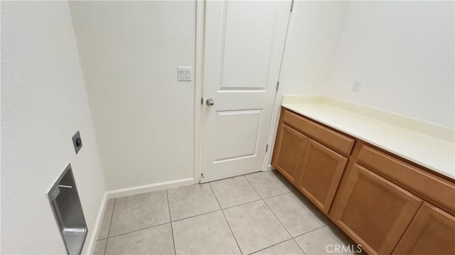 bathroom with tile patterned floors