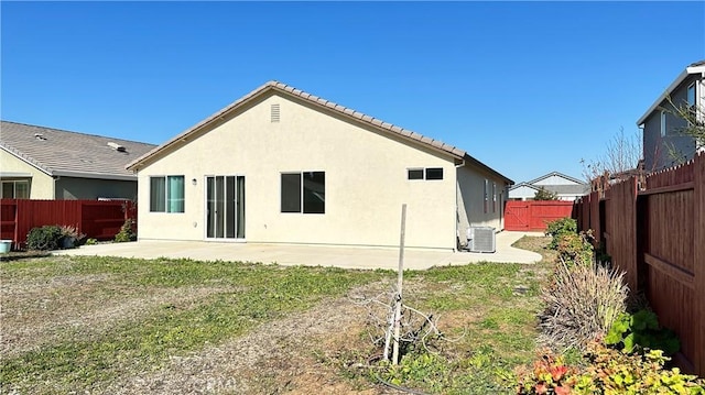 back of house featuring a patio, a yard, and cooling unit