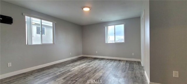 empty room with wood-type flooring