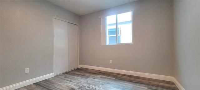 spare room featuring hardwood / wood-style flooring