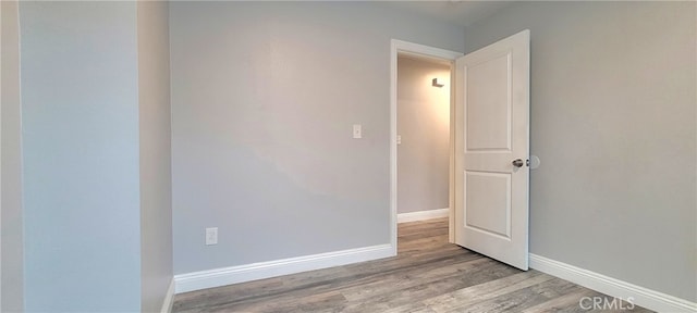 empty room featuring hardwood / wood-style flooring