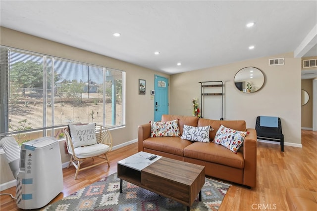 living room with light hardwood / wood-style floors