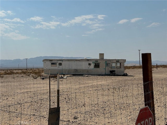 view of front of home featuring a mountain view