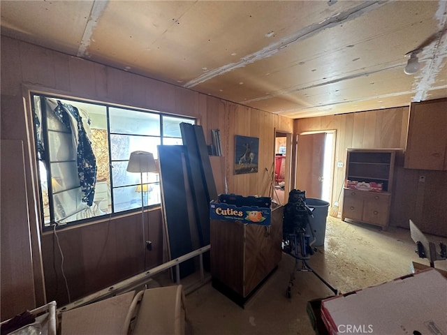 home office with wood walls