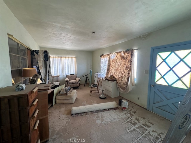 unfurnished living room featuring plenty of natural light