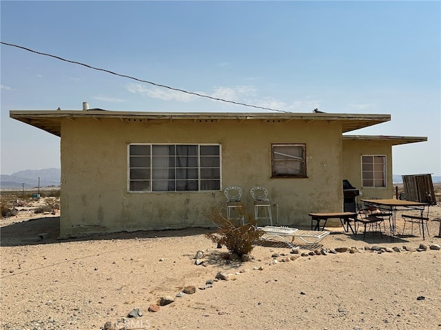 back of property with a patio area