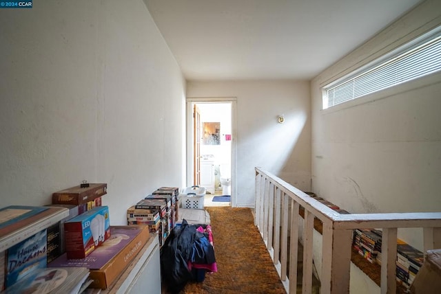 corridor featuring carpet flooring