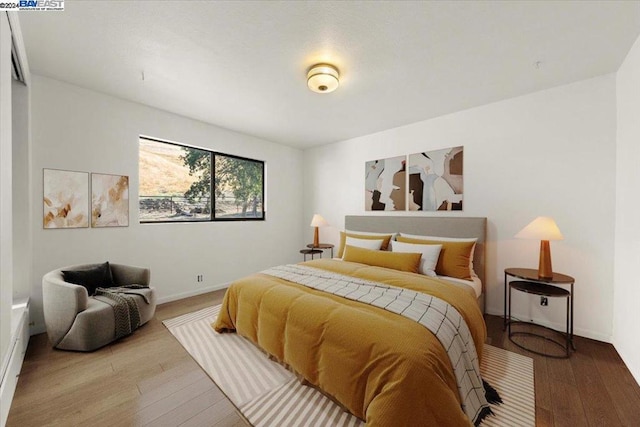 bedroom featuring wood-type flooring