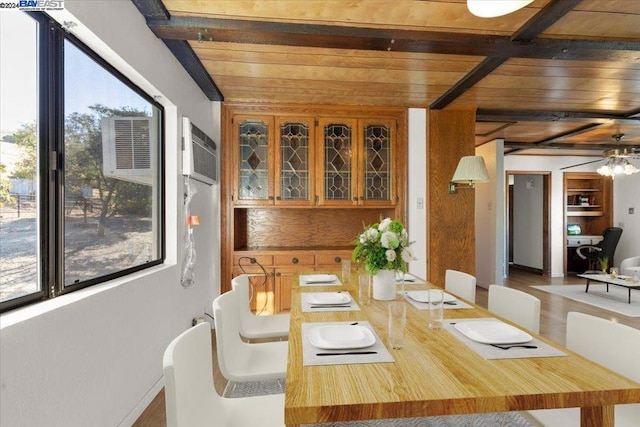 dining area with wooden ceiling, beam ceiling, ceiling fan, and hardwood / wood-style flooring