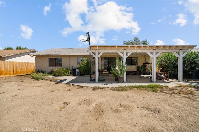 rear view of house featuring a patio and central AC