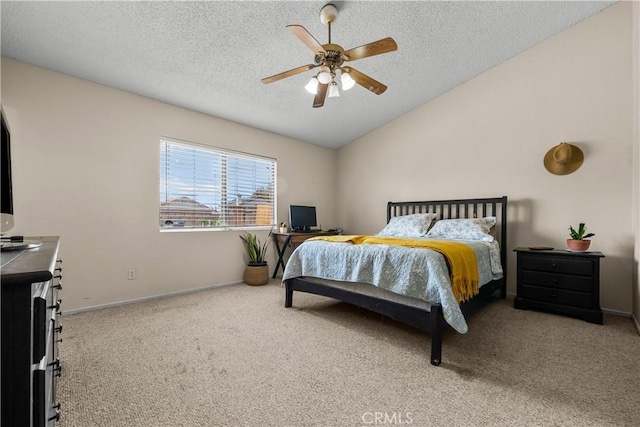 carpeted bedroom with a textured ceiling, ceiling fan, and lofted ceiling