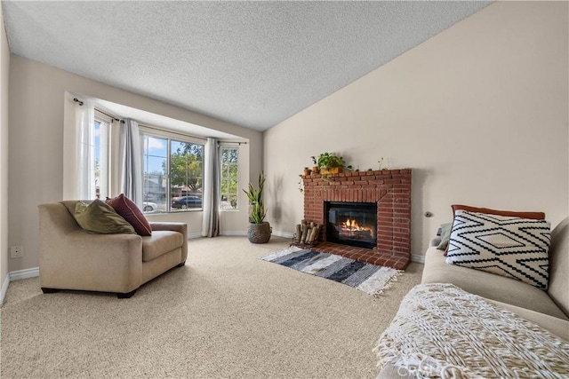 carpeted living room featuring a fireplace, a textured ceiling, and vaulted ceiling