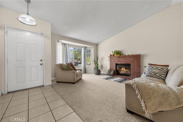 carpeted living room with lofted ceiling, a textured ceiling, and a brick fireplace