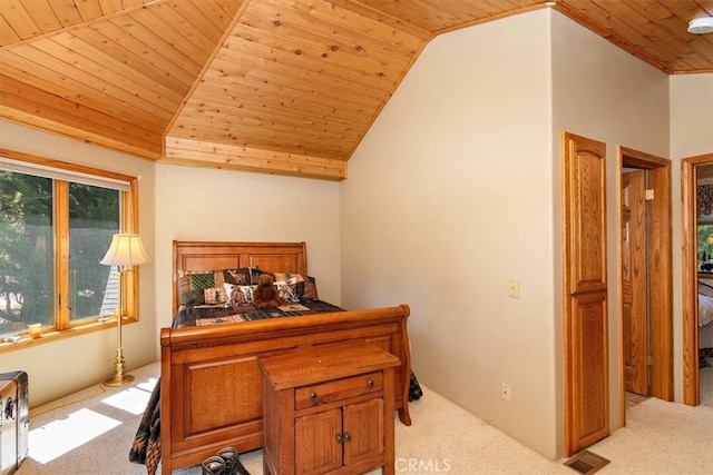 carpeted bedroom with wooden ceiling and lofted ceiling