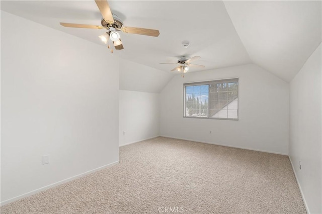 additional living space with carpet flooring, ceiling fan, and lofted ceiling