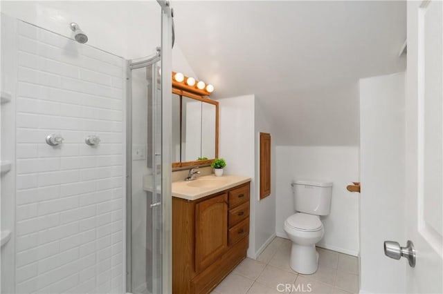 bathroom featuring tile patterned floors, vanity, toilet, and a shower with door