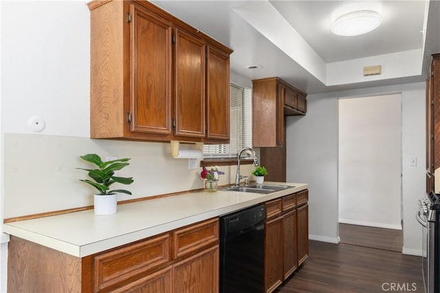 kitchen featuring sink, dark hardwood / wood-style floors, and black dishwasher