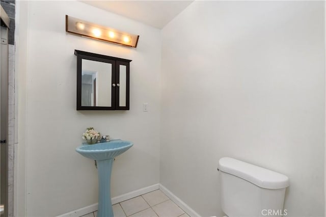 bathroom featuring tile patterned floors and toilet