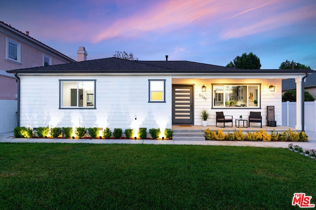 view of front of home with a yard