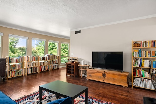 living room featuring a textured ceiling, crown molding, and dark hardwood / wood-style flooring