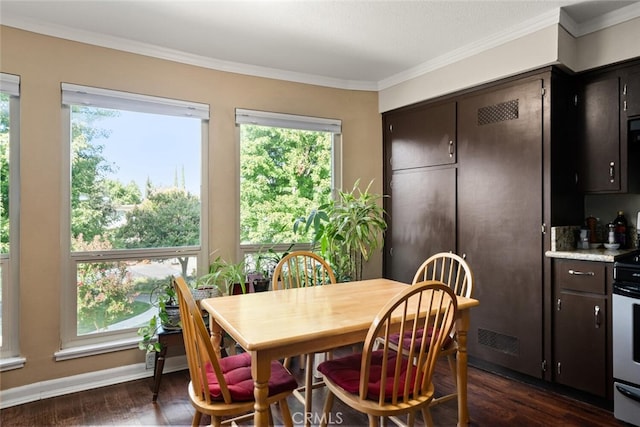 dining space featuring ornamental molding, dark wood-type flooring, and a healthy amount of sunlight