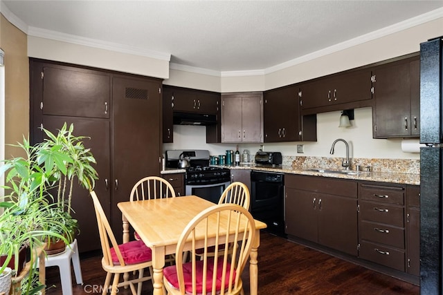 kitchen with gas stove, dark wood-type flooring, sink, dark brown cabinetry, and crown molding