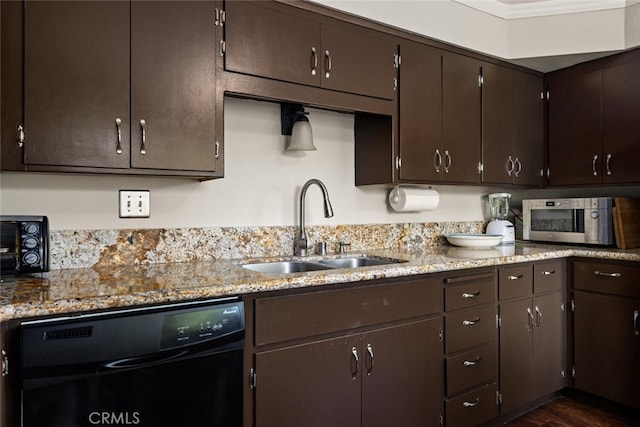 kitchen featuring black dishwasher, dark hardwood / wood-style floors, dark brown cabinetry, and sink