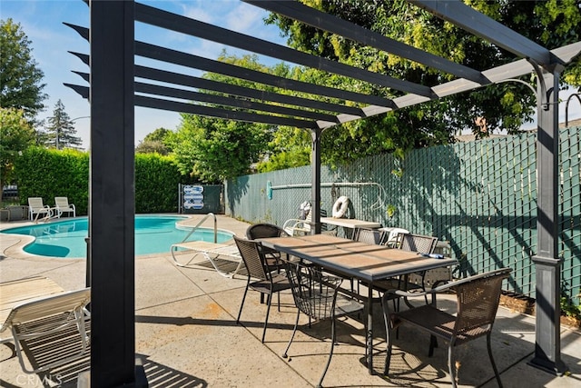 view of pool with a pergola and a patio