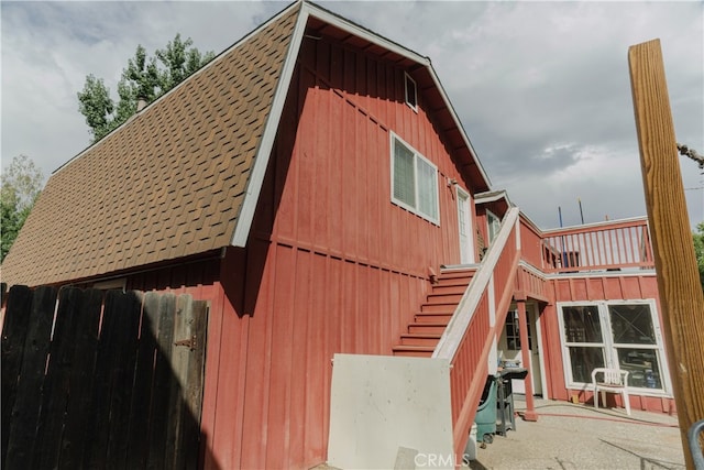 view of side of property with a patio area