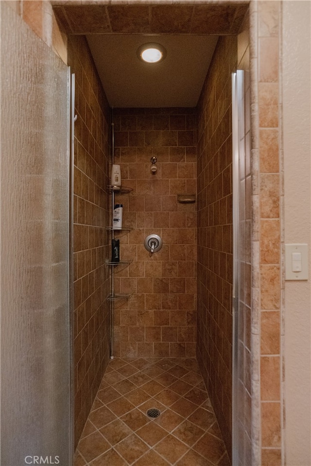 bathroom with tiled shower