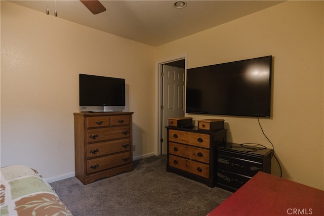 bedroom featuring dark carpet and ceiling fan