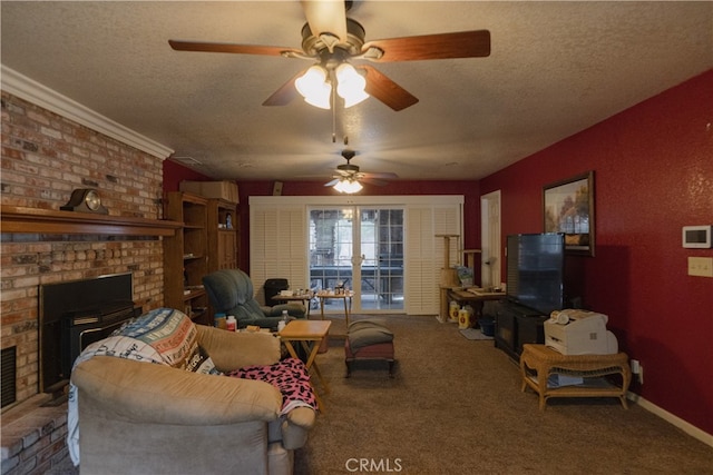 carpeted living room with ceiling fan, a textured ceiling, a fireplace, and ornamental molding