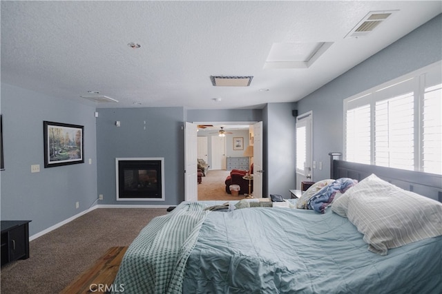 carpeted bedroom with a textured ceiling