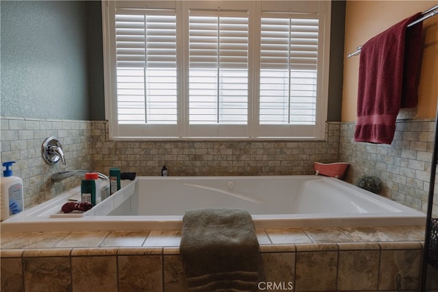 bathroom with tiled tub