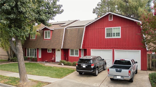 view of front facade with a front lawn and a garage