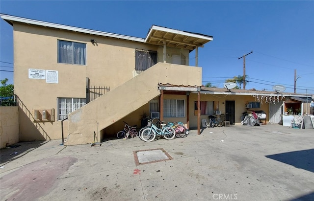 back of house with a patio