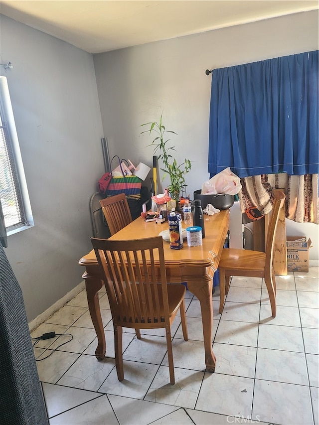 dining room featuring light tile patterned flooring