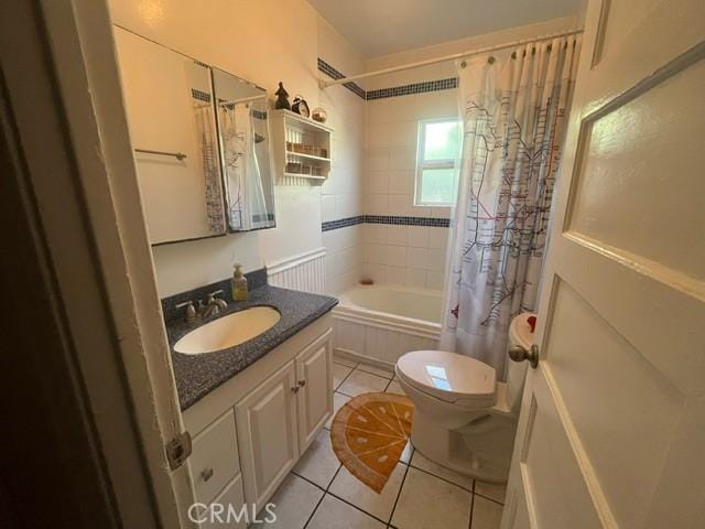 full bathroom featuring toilet, tile patterned flooring, shower / tub combo, and vanity