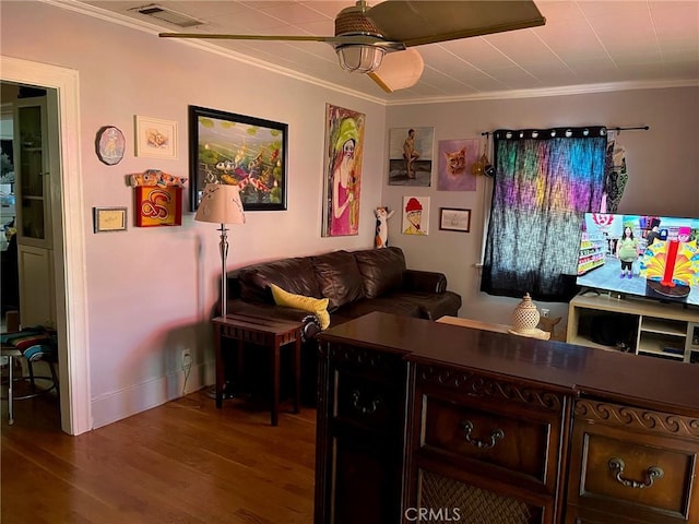 living room with ceiling fan, crown molding, and wood-type flooring