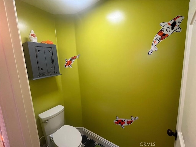 bathroom featuring toilet