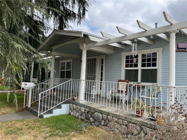 property entrance with covered porch