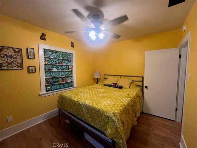 bedroom featuring ceiling fan and hardwood / wood-style floors