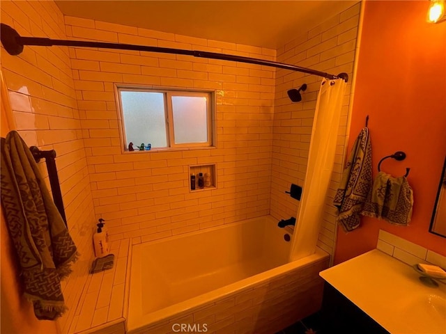 bathroom featuring shower / tub combo and vanity