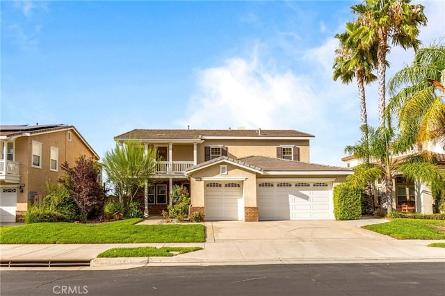 front of property featuring a garage and a balcony