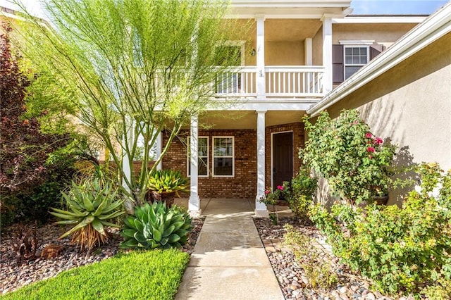 entrance to property featuring a balcony