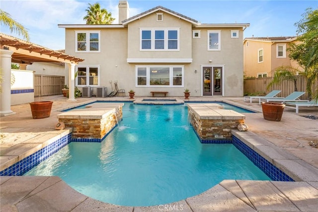 view of swimming pool featuring a pergola, central AC, pool water feature, an in ground hot tub, and a patio