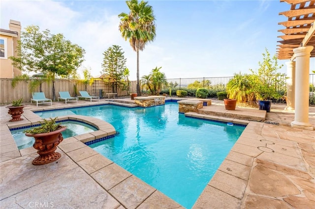 view of swimming pool with a patio area and an in ground hot tub