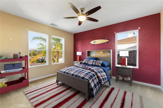 carpeted bedroom with ceiling fan