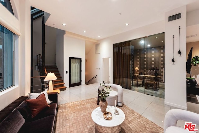 living room with light tile patterned floors