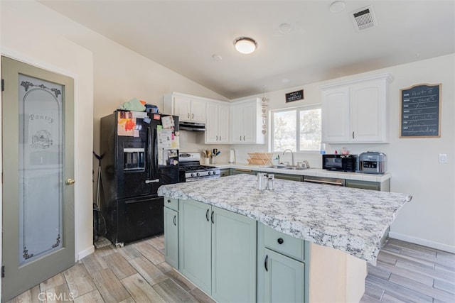 kitchen with black appliances, a center island, light hardwood / wood-style flooring, and white cabinets